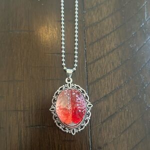 Ornate Silver Pendant Necklace with Red Cabochon